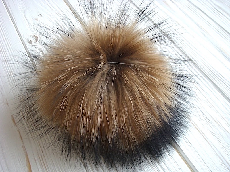 Fur pompoms for hats made of natural fox and raccoon fur